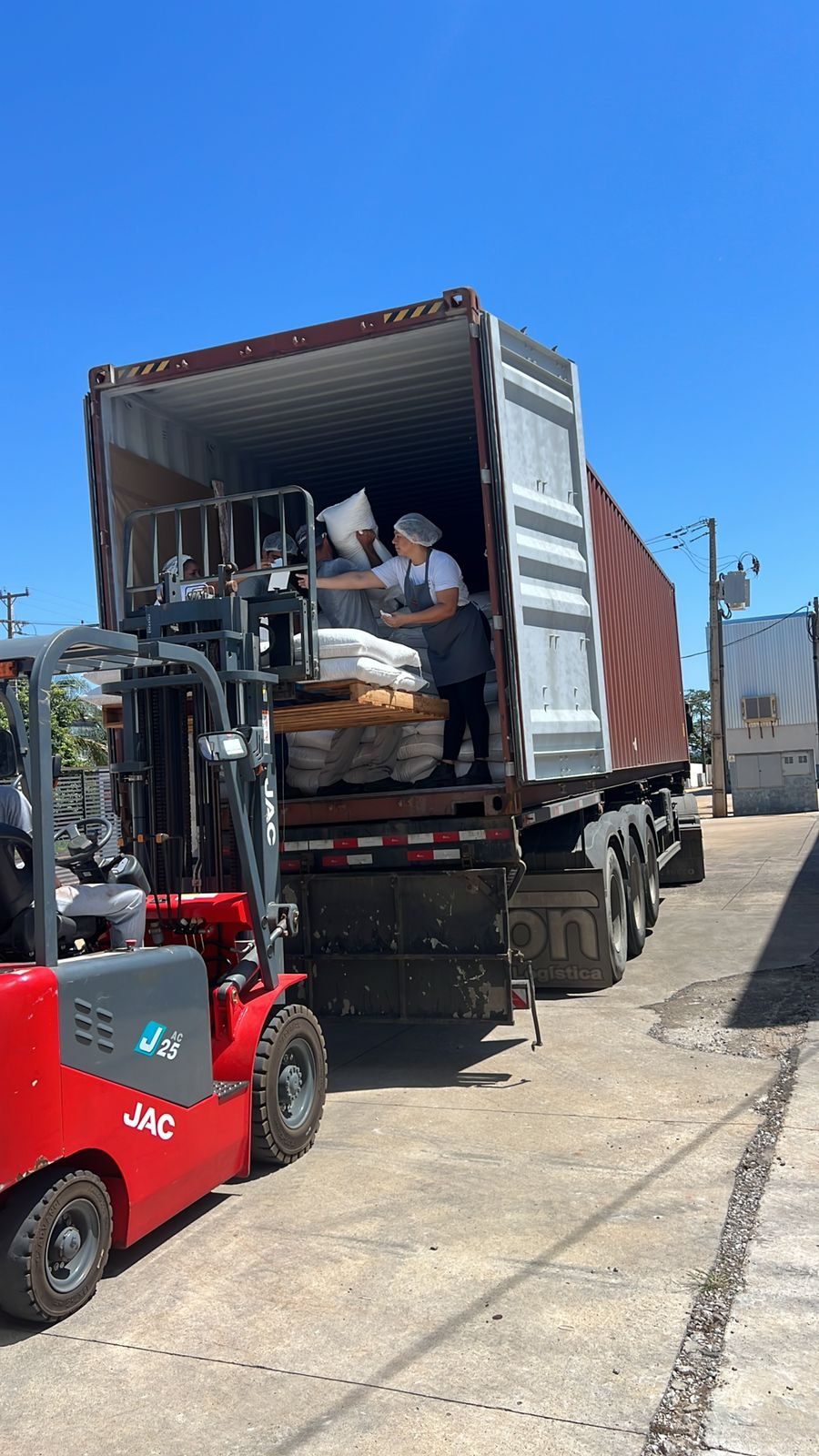 Forklift loading a container